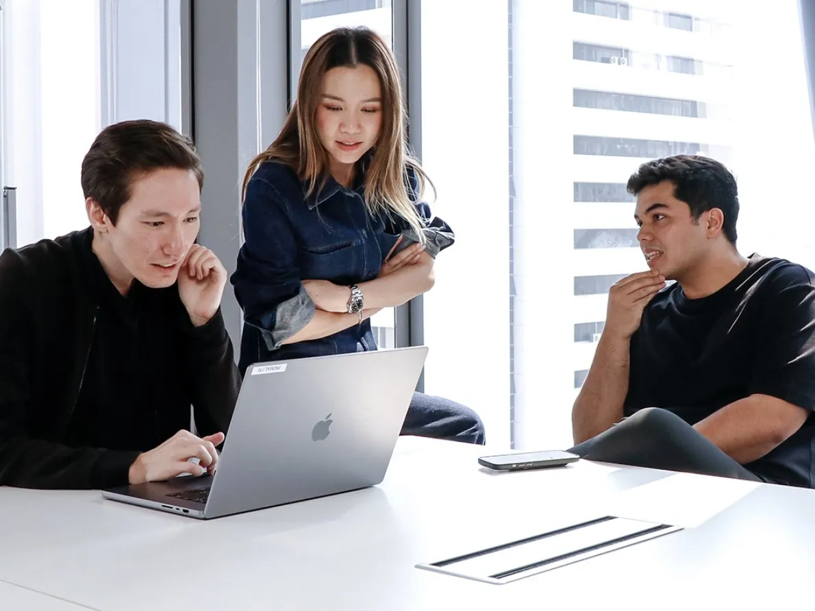 Primal team members working on a laptop together