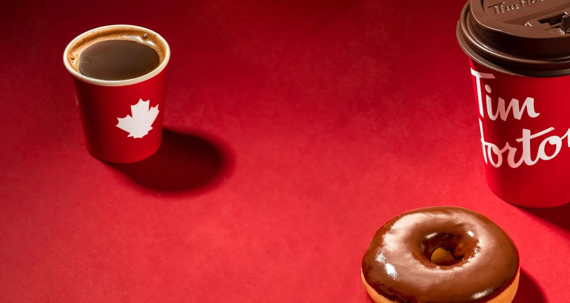 Tim Hortons: a red cup and a chocolate-dipped doughnut on red
